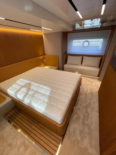  Yacht Photos Pics Luxurious bedroom interior of 2025 Cranchi 62 Sessantadue yacht with modern design.
