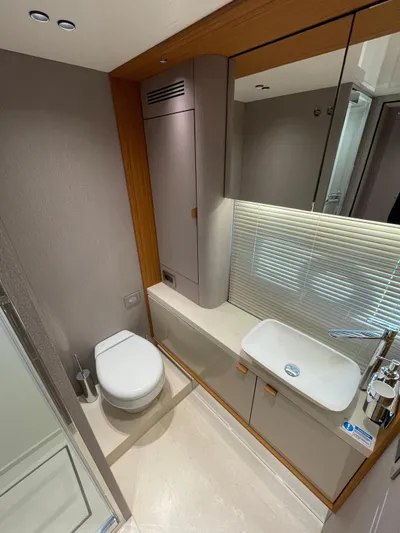  Yacht Photos Pics Luxurious bathroom in 2025 Cranchi 62 Sessantadue yacht with modern fixtures and elegant design.