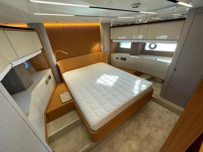  Yacht Photos Pics Luxurious bedroom interior of 2025 Cranchi 62 Sessantadue yacht with modern design.