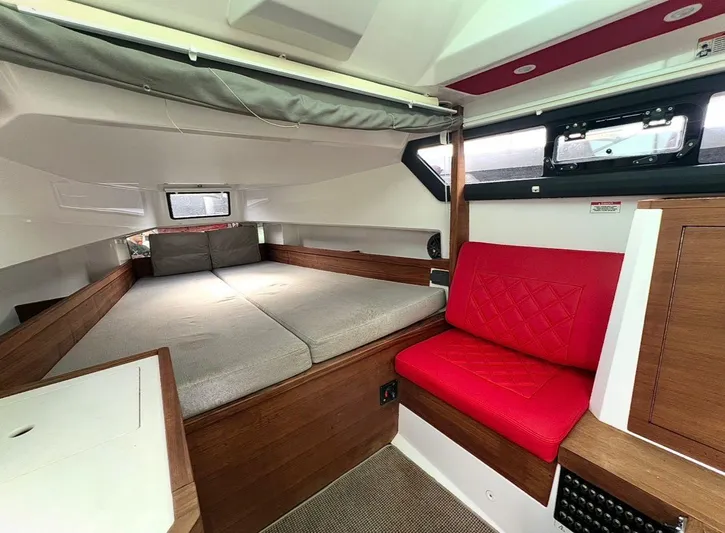  Yacht Photos Pics Interior of 2018 Axopar 37 Sun-Top with bed and red seating.
