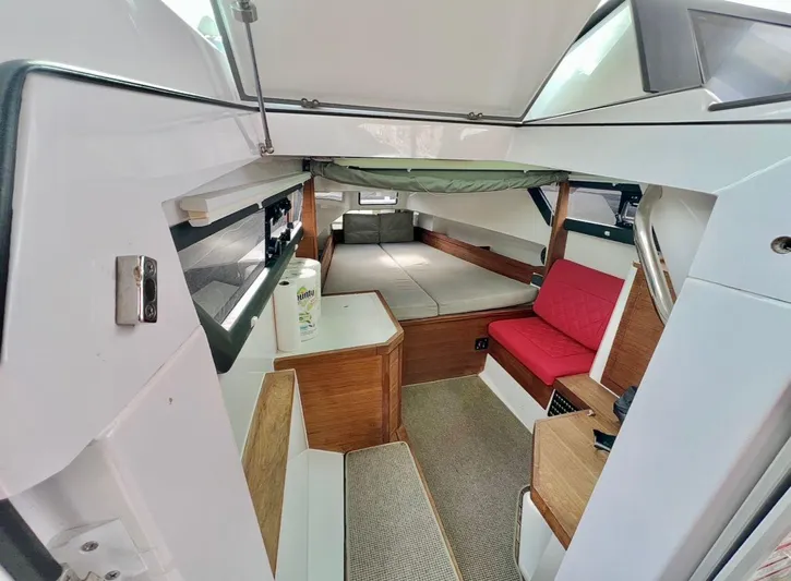  Yacht Photos Pics 2018 Axopar 37 Sun-Top cabin interior with seating and sleeping area.