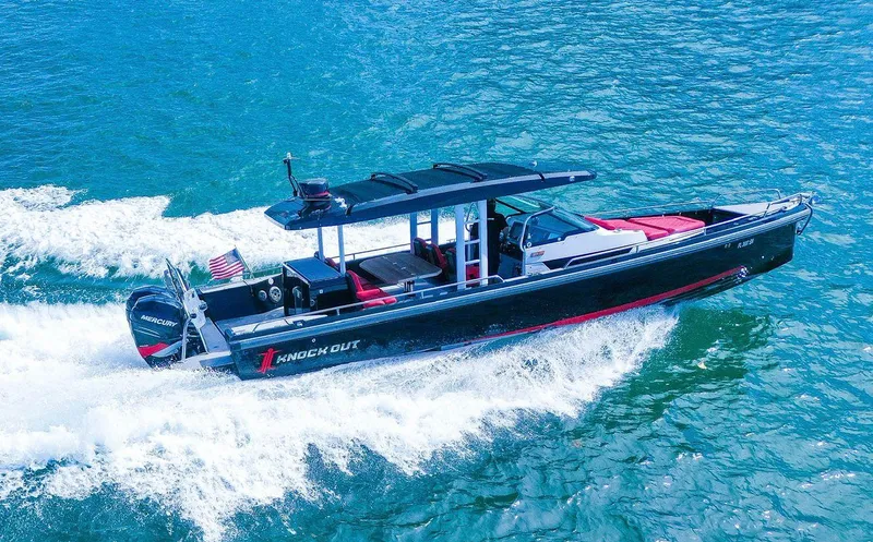  Yacht Photos Pics 2018 Axopar 37 Sun-Top boat cruising on blue water, featuring sleek design and powerful engines.