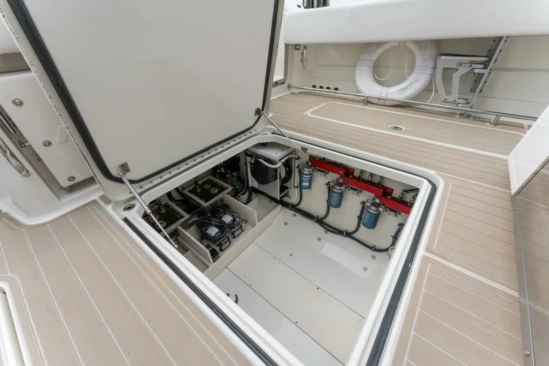  Yacht Photos Pics 2018 Hydra-Sports 4200 Siesta boat engine compartment with open hatch and visible components.