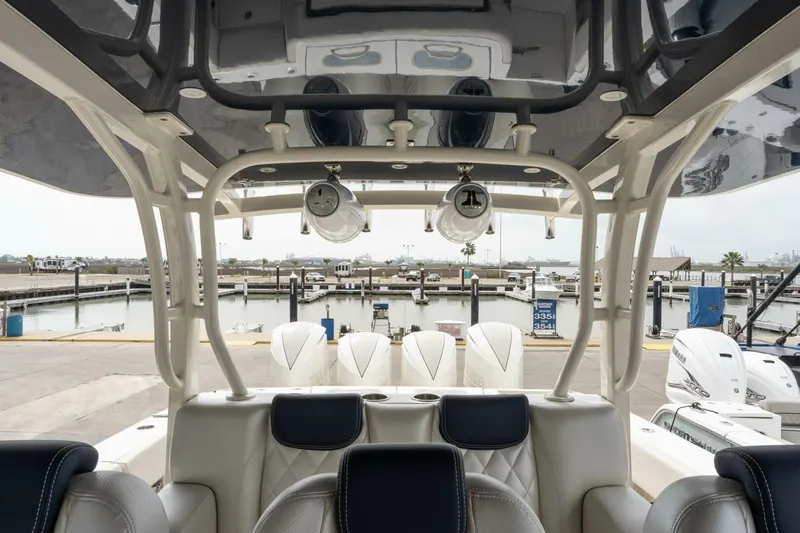  Yacht Photos Pics 2018 Hydra-Sports 4200 Siesta boat interior at marina, showcasing luxury seating and powerful engines.