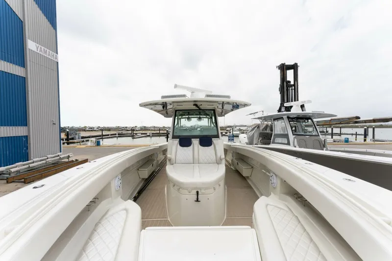  Yacht Photos Pics 2018 Hydra-Sports 4200 Siesta boat docked at marina, showcasing spacious deck and seating.