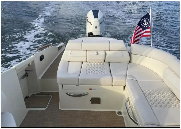  Yacht Photos Pics 2021 Chris-Craft 28 Launch GT boat with luxurious seating and American flag.