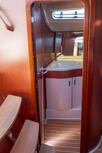 Anthem Yacht Photos Pics 2022 Dehler 34 yacht interior with wooden finish and compact design.