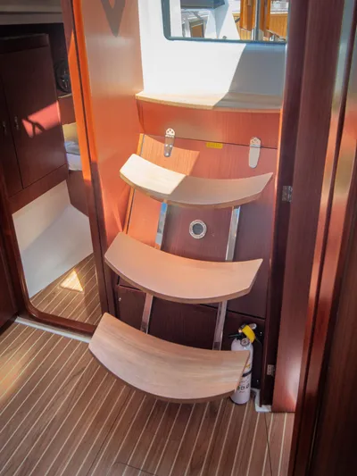 Anthem Yacht Photos Pics Interior of 2022 Dehler 34 yacht with wooden steps and modern design.