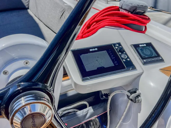 Anthem Yacht Photos Pics Helm of 2022 Dehler 34 sailboat with navigation display and red rope.