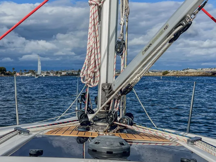 Anthem Yacht Photos Pics Dehler 34 sailboat, 2022 model, on water with clear skies and distant sailboat.