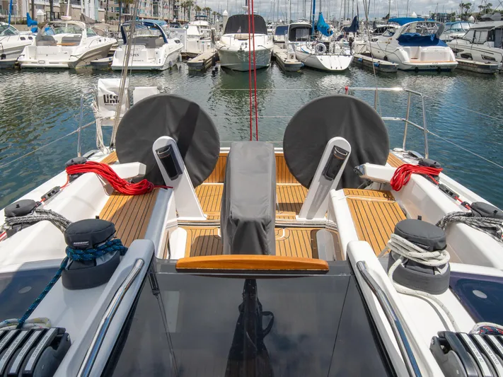 Anthem Yacht Photos Pics 2022 Dehler 34 yacht docked in a marina, featuring a sleek deck design.