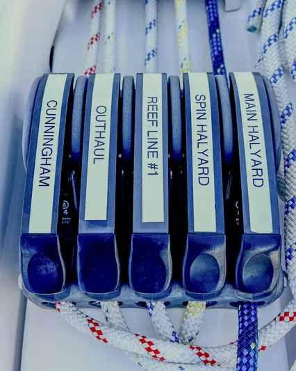 Anthem Yacht Photos Pics Dehler 34 (2022) sailboat control panel with labeled rope clutches: Cunningham, Outhaul, Reef Line #1, Spin Halyard, Main Halyard.