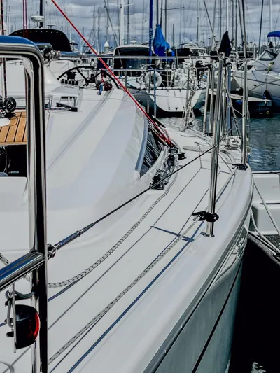 Anthem Yacht Photos Pics 2022 Dehler 34 yacht docked in a marina, showcasing sleek design and modern features.