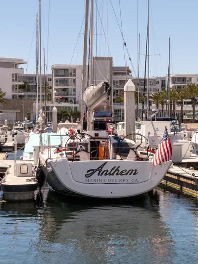 Anthem Yacht Photos Pics Dehler 34 sailboat docked at Marina del Rey, 2022 model, with American flag.