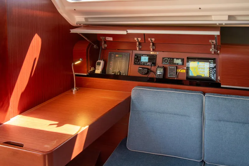 Anthem Yacht Photos Pics Interior of 2022 Dehler 34 yacht with navigation equipment and seating area.