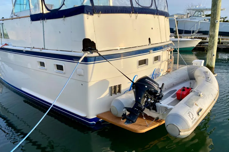 Lazy Livin' Yacht Photos Pics 1971 Hatteras 43 Double Cabin yacht with inflatable boat and outboard motor.