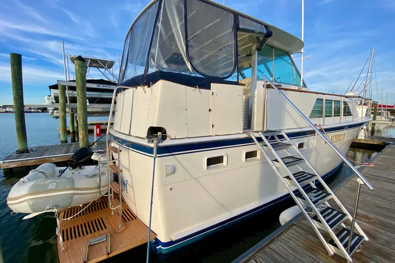 Lazy Livin' Yacht Photos Pics 1971 Hatteras 43 Double Cabin yacht docked with inflatable boat attached.