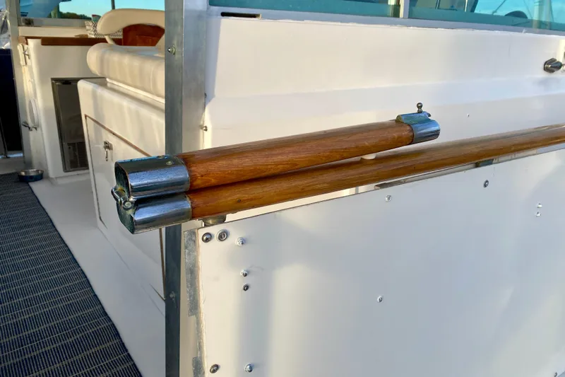 Lazy Livin' Yacht Photos Pics 1971 Hatteras 43 Double Cabin interior with wooden handrails and seating area.