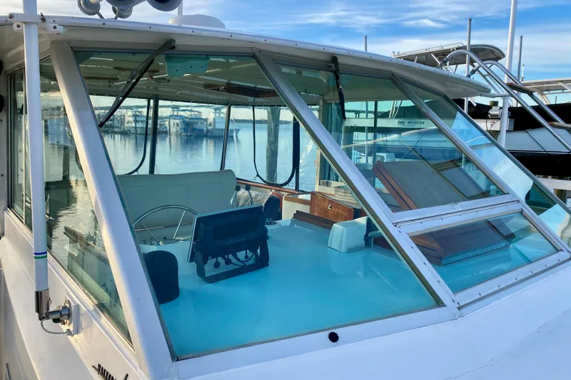 Lazy Livin' Yacht Photos Pics 1971 Hatteras 43 Double Cabin yacht interior with steering wheel and navigation equipment.