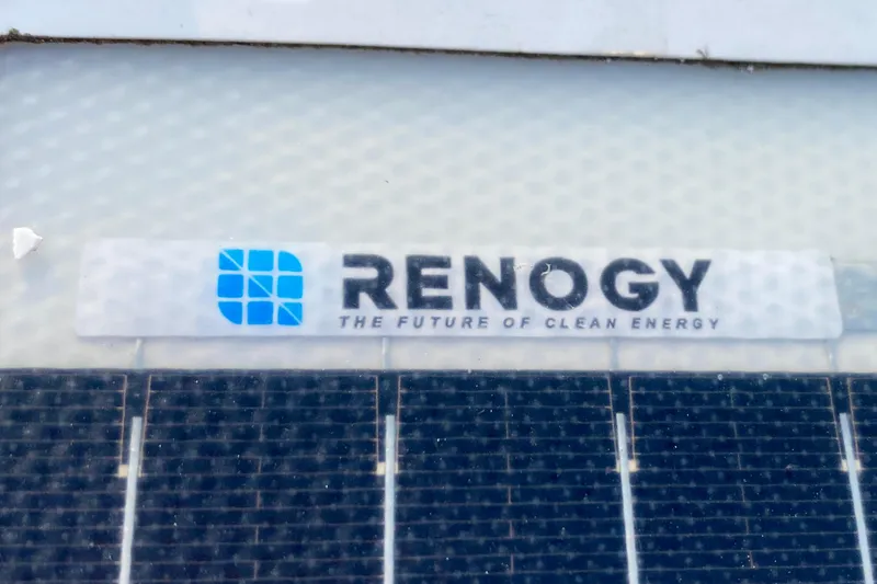 Lazy Livin' Yacht Photos Pics Renogy solar panel on 1971 Hatteras 43 Double Cabin, promoting clean energy.