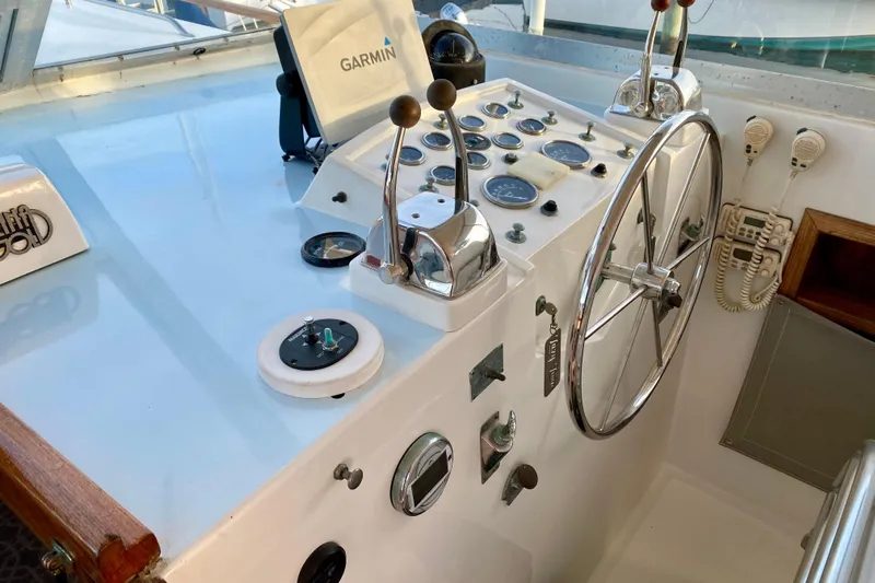 Lazy Livin' Yacht Photos Pics 1971 Hatteras 43 Double Cabin helm with Garmin navigation and classic controls.