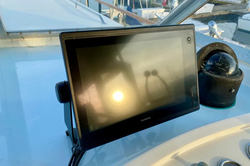 Lazy Livin' Yacht Photos Pics Garmin navigation display and compass on 1971 Hatteras 43 Double Cabin yacht.