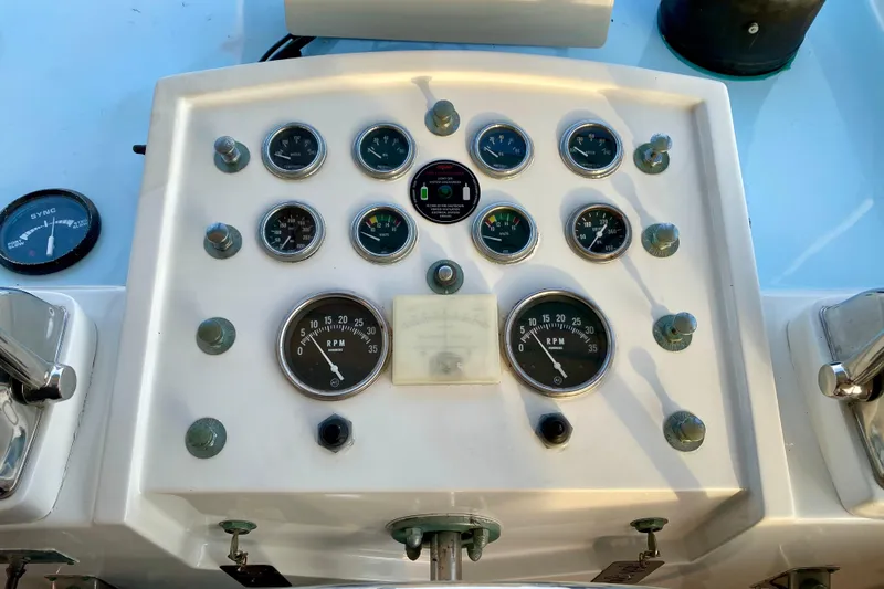 Lazy Livin' Yacht Photos Pics Control panel of a 1971 Hatteras 43 Double Cabin boat with gauges and dials.