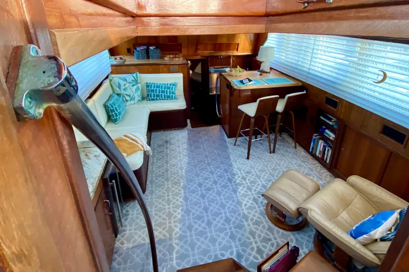 Lazy Livin' Yacht Photos Pics Interior of 1971 Hatteras 43 Double Cabin with cozy seating and nautical decor.