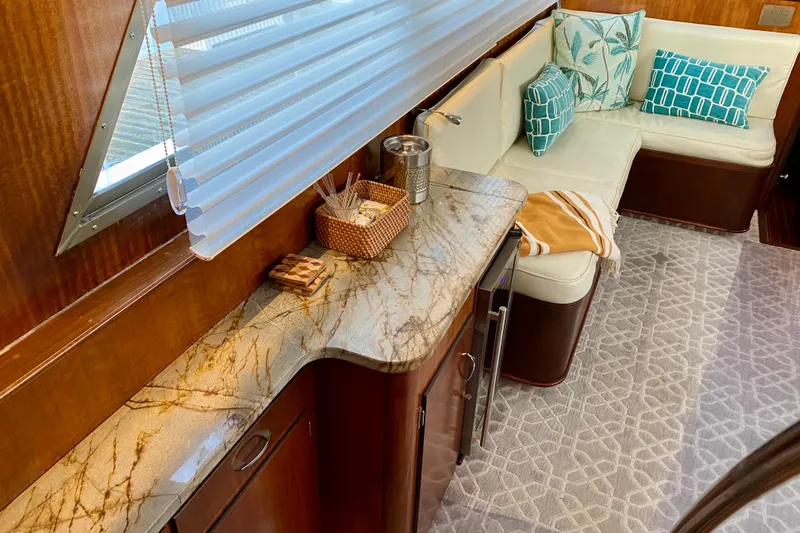 Lazy Livin' Yacht Photos Pics 1971 Hatteras 43 Double Cabin interior with elegant seating and marble countertop.
