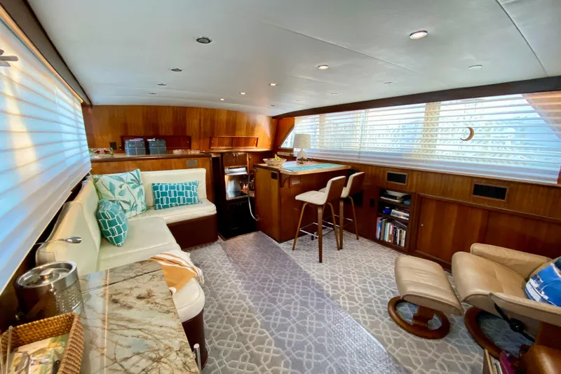 Lazy Livin' Yacht Photos Pics Luxurious interior of a 1971 Hatteras 43 Double Cabin yacht with elegant seating and decor.