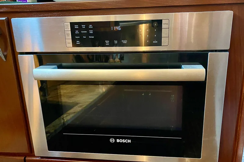 Lazy Livin' Yacht Photos Pics Bosch built-in microwave oven with digital display in a Hatteras 43 Double Cabin yacht kitchen.