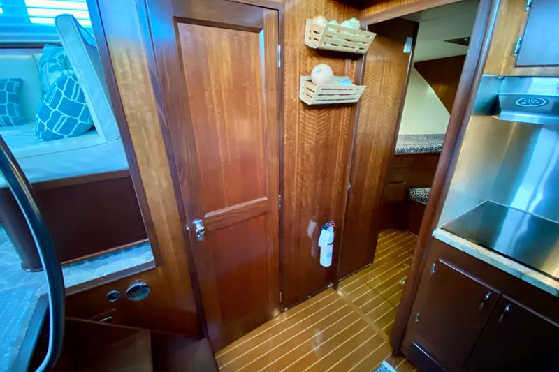 Lazy Livin' Yacht Photos Pics 1971 Hatteras 43 Double Cabin interior with wood paneling and modern kitchen features.