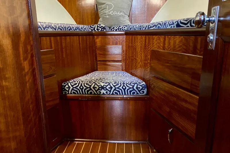 Lazy Livin' Yacht Photos Pics 1971 Hatteras 43 Double Cabin interior with wood finish and patterned cushions.