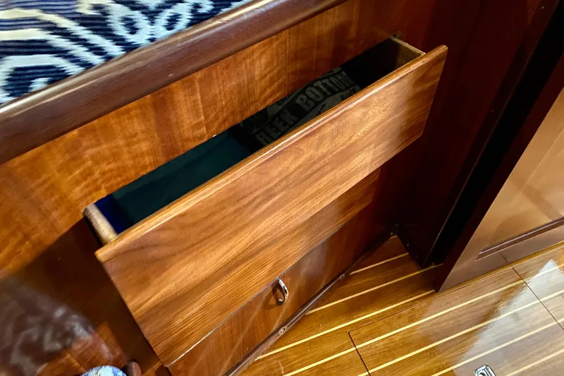Lazy Livin' Yacht Photos Pics Wooden drawer in 1971 Hatteras 43 Double Cabin, showcasing interior craftsmanship.