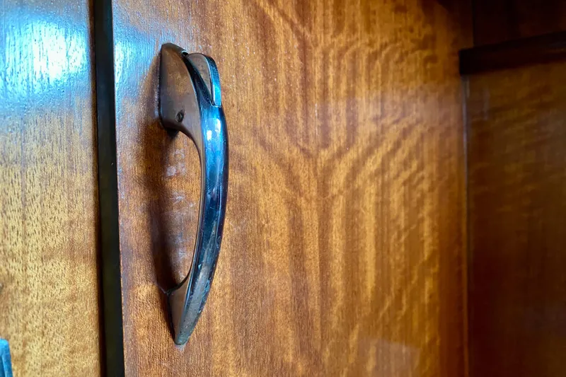 Lazy Livin' Yacht Photos Pics Wooden cabinet handle on 1971 Hatteras 43 Double Cabin boat.
