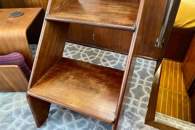 Lazy Livin' Yacht Photos Pics Wooden interior stairs on a 1971 Hatteras 43 Double Cabin yacht.