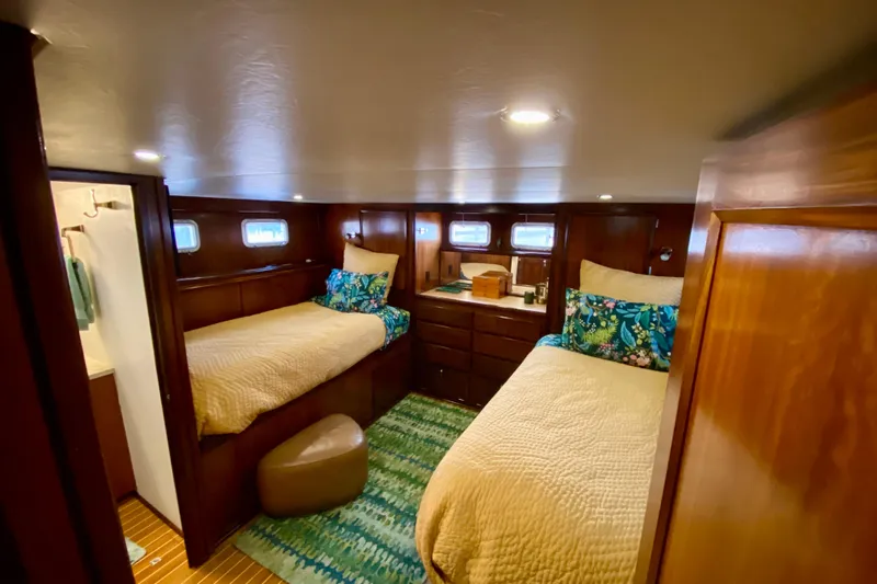 Lazy Livin' Yacht Photos Pics 1971 Hatteras 43 Double Cabin interior with twin beds, wooden cabinetry, and nautical decor.
