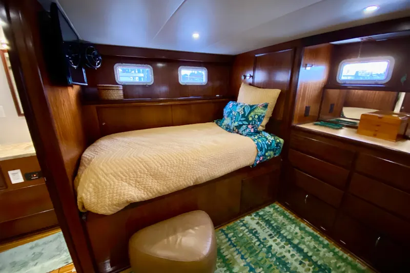 Lazy Livin' Yacht Photos Pics 1971 Hatteras 43 Double Cabin interior with cozy bed and wooden furnishings.
