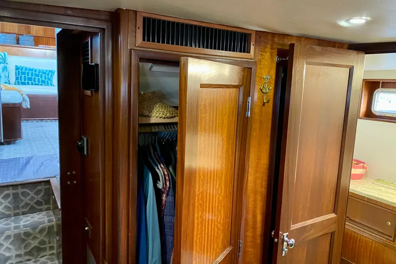 Lazy Livin' Yacht Photos Pics Interior of 1971 Hatteras 43 Double Cabin with wooden closets and cozy decor.