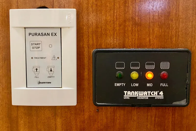Lazy Livin' Yacht Photos Pics Control panels on 1971 Hatteras 43 Double Cabin, featuring Purasan EX and TankWatch 4 systems.