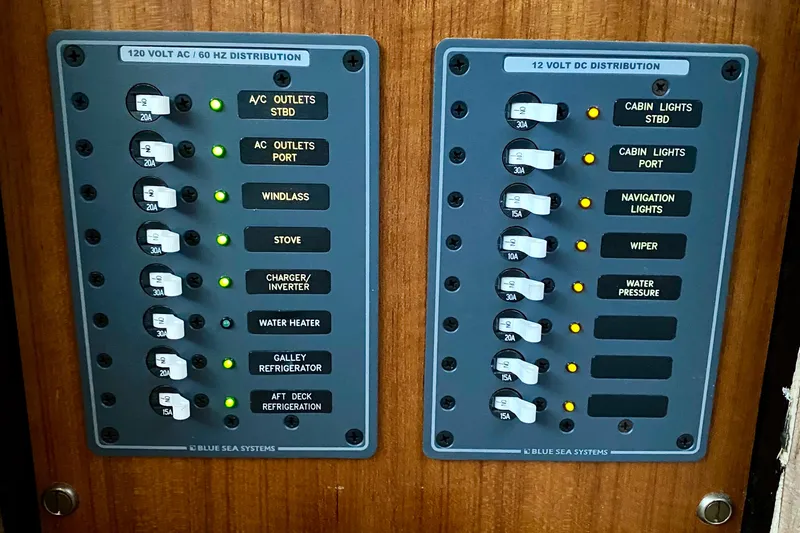 Lazy Livin' Yacht Photos Pics Electrical panel on a 1971 Hatteras 43 Double Cabin boat, featuring AC and DC distribution.