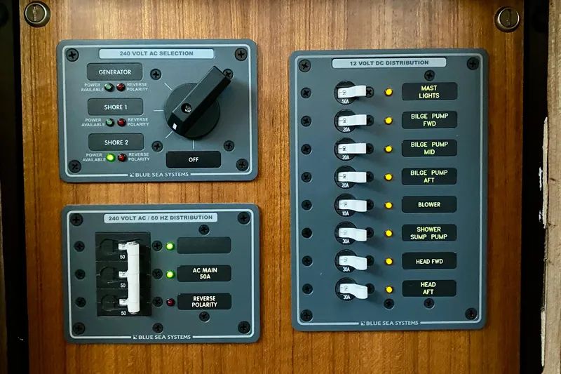 Lazy Livin' Yacht Photos Pics Electrical panel of a 1971 Hatteras 43 Double Cabin boat, featuring AC and DC distribution.