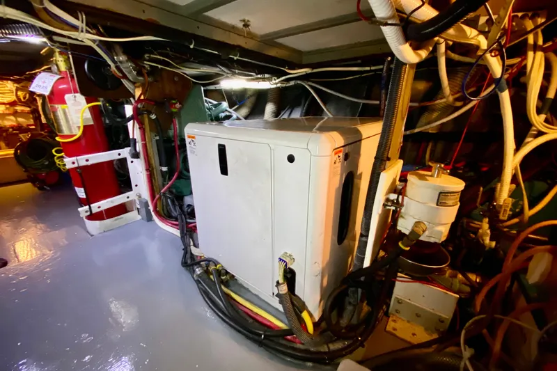 Lazy Livin' Yacht Photos Pics Engine room of 1971 Hatteras 43 Double Cabin with machinery and wiring.