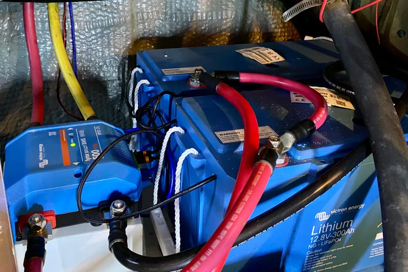 Lazy Livin' Yacht Photos Pics Battery setup in a 1971 Hatteras 43 Double Cabin boat, featuring lithium batteries and wiring.