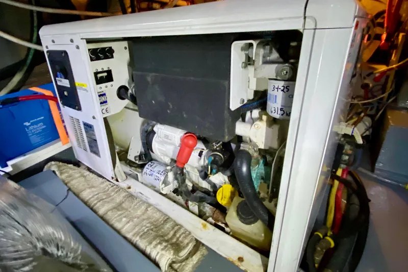 Lazy Livin' Yacht Photos Pics Engine compartment of a 1971 Hatteras 43 Double Cabin boat, showing mechanical components.