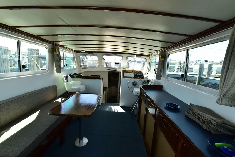 About Time Yacht Photos Pics Interior of 1998 Duffy 35 Downeast Cruiser with seating and helm.