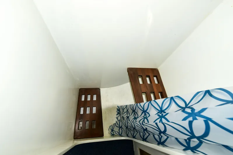 About Time Yacht Photos Pics Interior cabin of 1998 Duffy 35 Downeast Cruiser with patterned bedding.