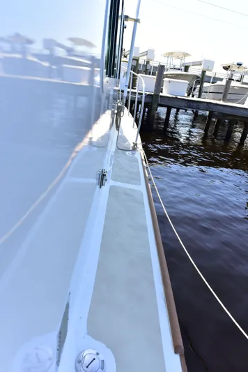 About Time Yacht Photos Pics 1998 Duffy 35 Downeast Cruiser docked by the water.