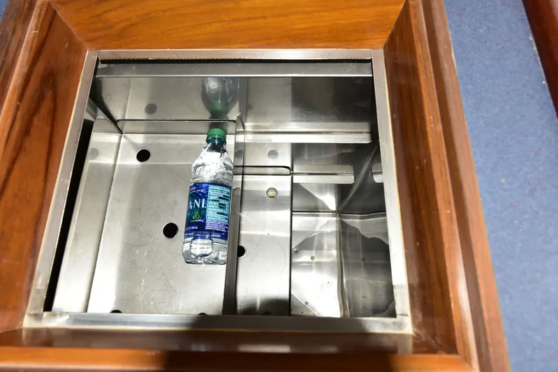 About Time Yacht Photos Pics Stainless steel compartment with water bottle in 1998 Duffy 35 Downeast Cruiser.