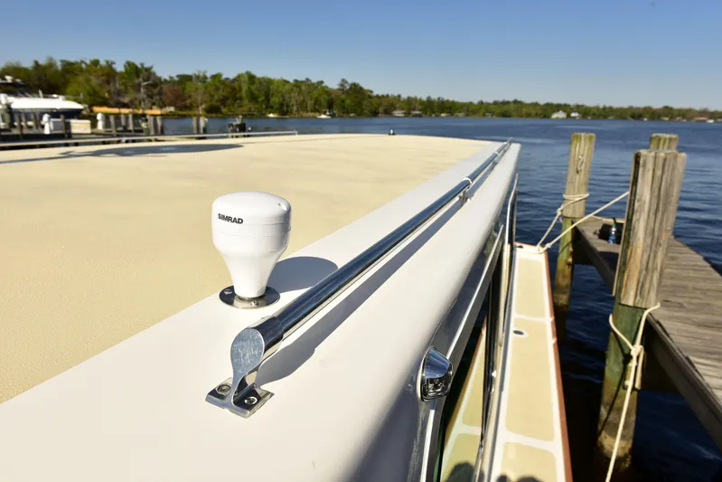 About Time Yacht Photos Pics 1998 Duffy 35 Downeast Cruiser docked by a serene lake.